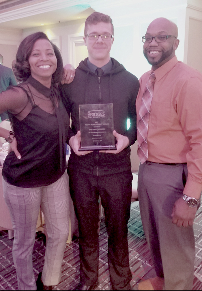 Pictured from left to right Shebtufi Kushma, Orlando Herera, and Reginald “Reggie” Watson. Orlando was the Bridges from School to Work 2017 Youth Achievement Award Recipient.
